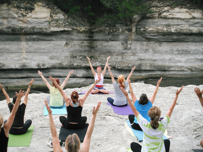 Women Doing a Yoga Class Outdoors